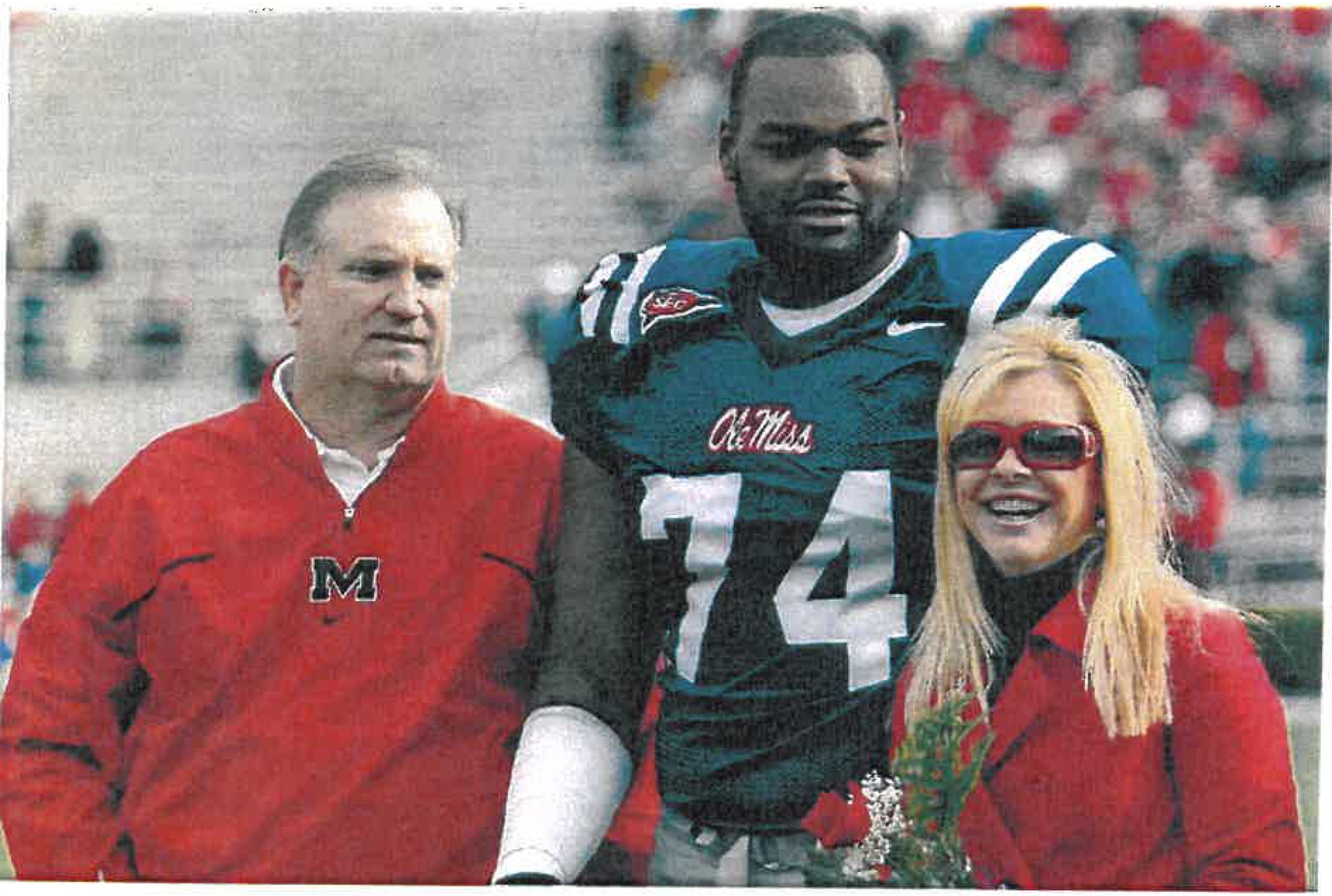From left: Sean Tuohy, Michael Oher, and Leigh Anne Tuohy.</br>
Credit : Matthew Sharpe/Getty